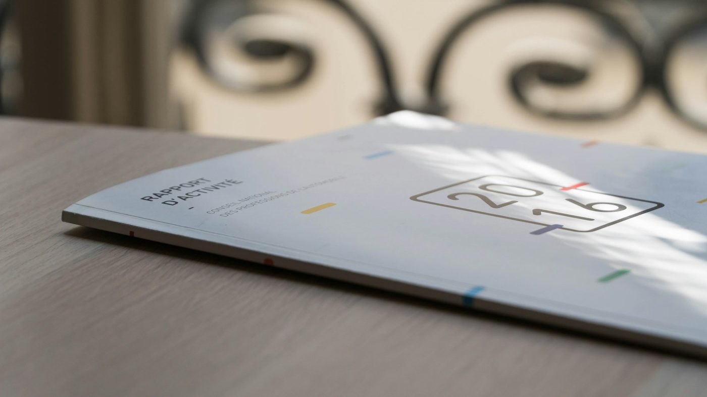 An open printed report on a desk